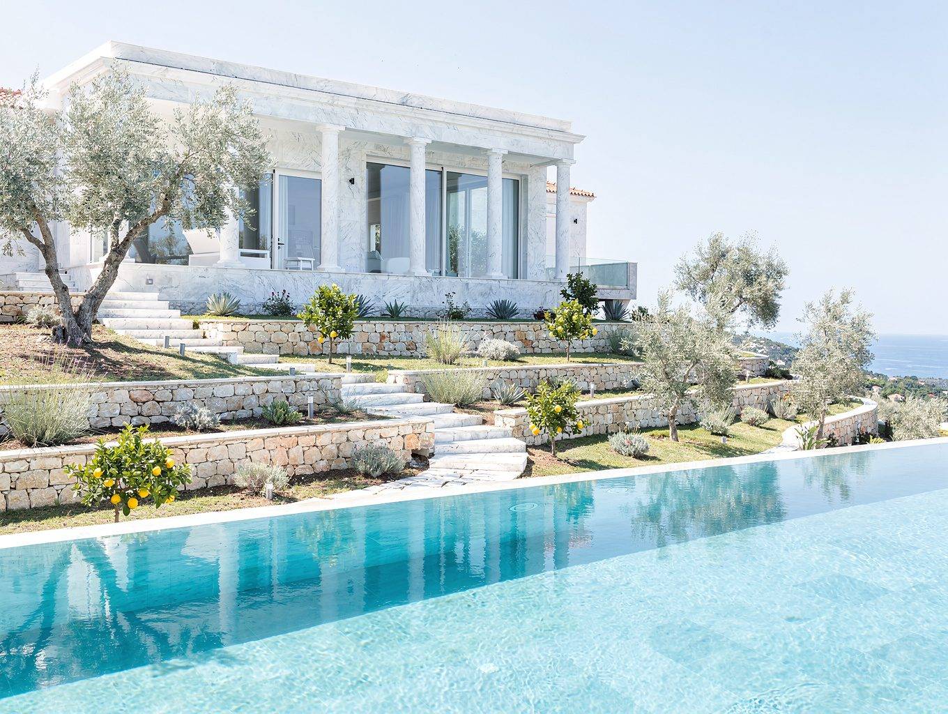 Exterior view of a luxury villa in Corfu with private pool and Mediterranean terrace